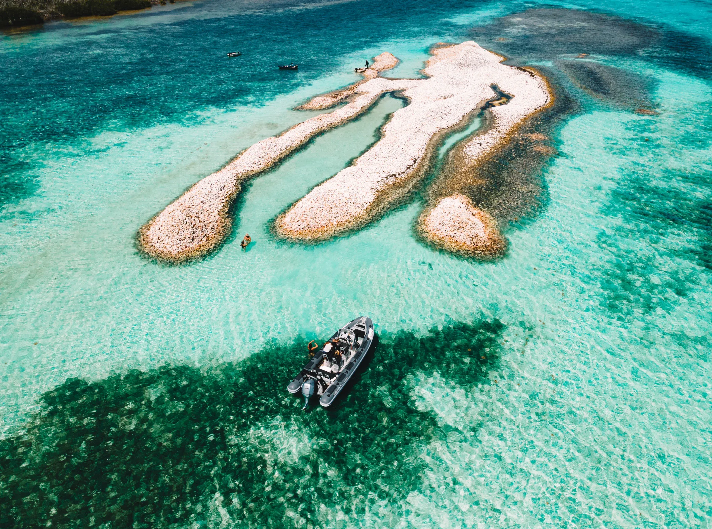 Conch Shell Island from the air with the boat alongside
